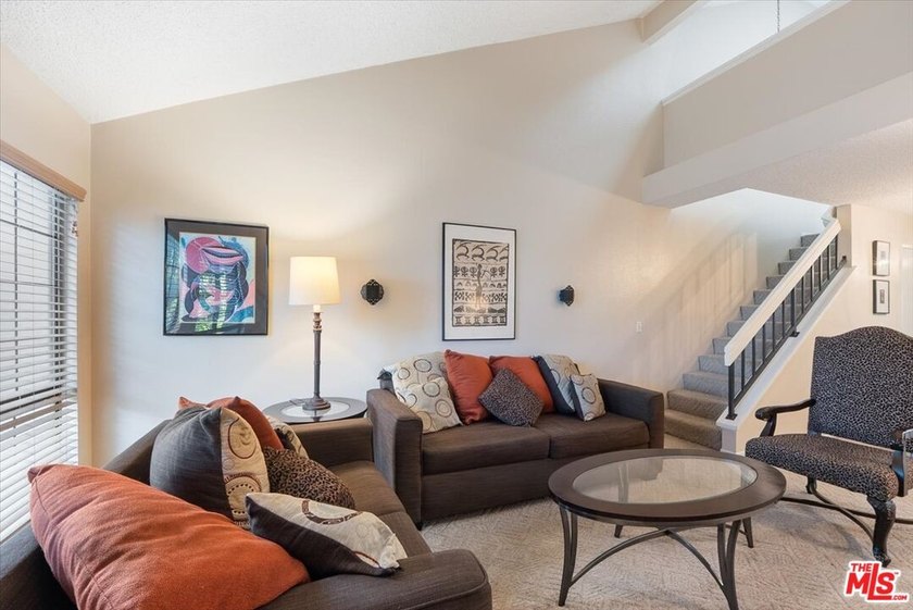 Welcome to this spacious two-story townhome-style condo in the - photo 4
