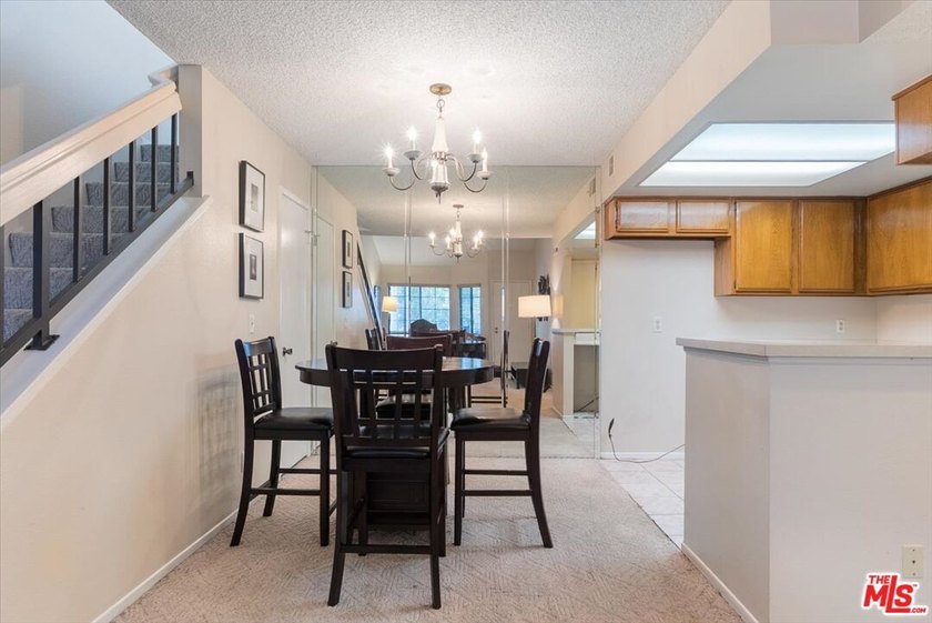 Welcome to this spacious two-story townhome-style condo in the - photo 6