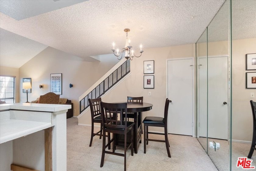 Welcome to this spacious two-story townhome-style condo in the - photo 7
