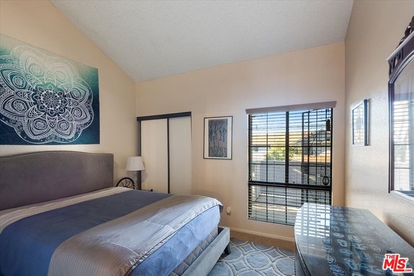 Welcome to this spacious two-story townhome-style condo in the - photo 8