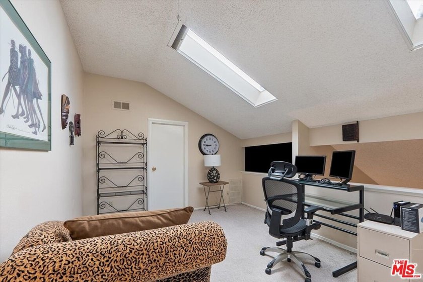 Welcome to this spacious two-story townhome-style condo in the - photo 10