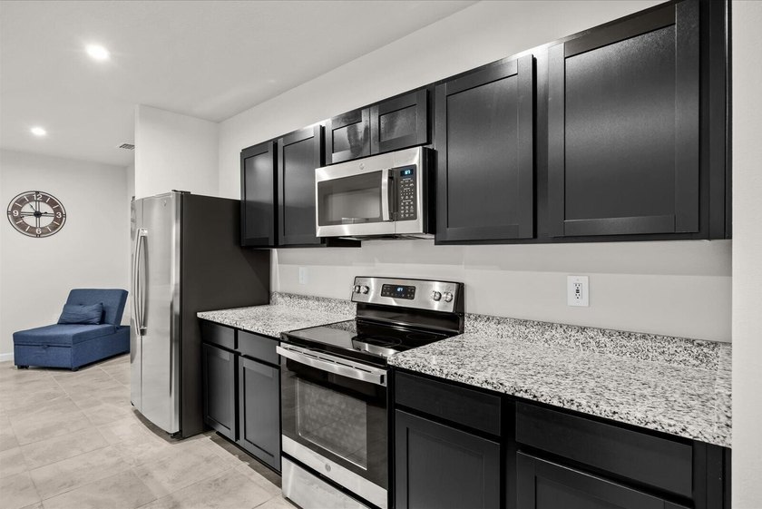 Welcome to this charming 3-bedroom, 2-bath villa in Avalon - photo 10