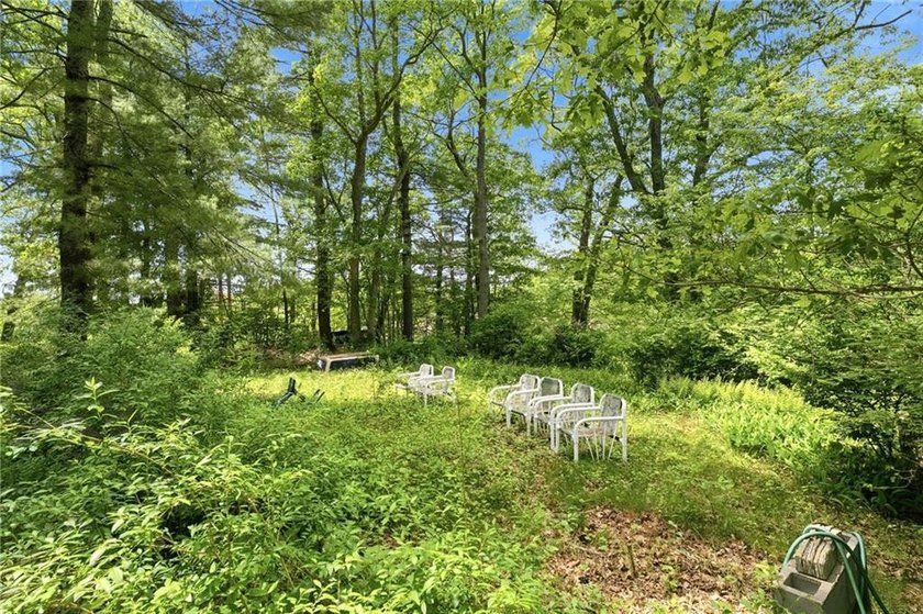 Set on nearly an acre in North Kingstown, this 3-bedroom, 1-bath - photo 11