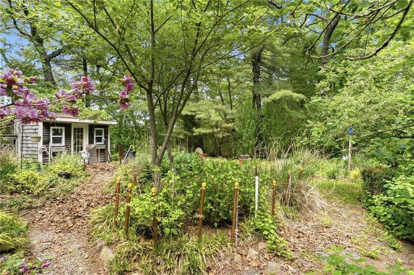 Set on nearly an acre in North Kingstown, this 3-bedroom, 1-bath - photo 12