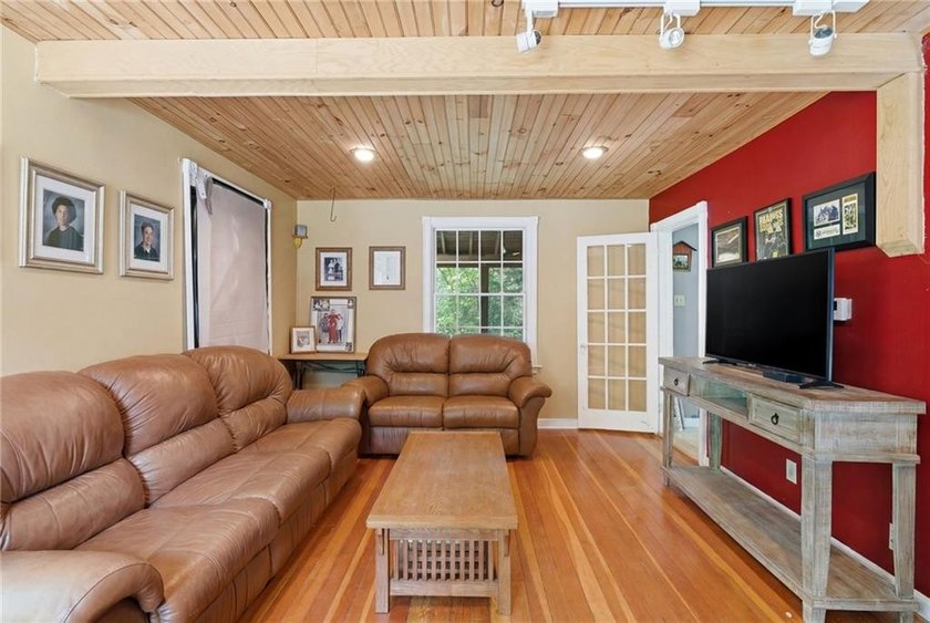 Set on nearly an acre in North Kingstown, this 3-bedroom, 1-bath - photo 16