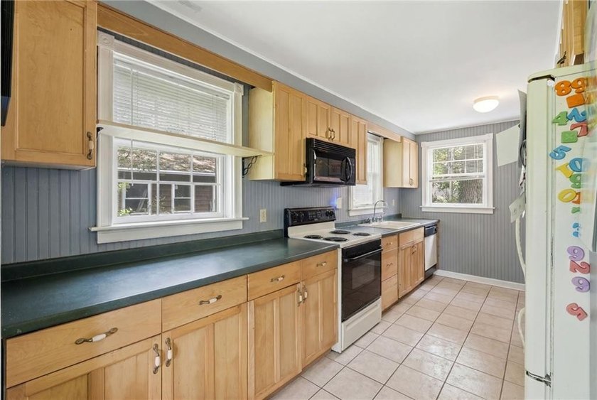 Set on nearly an acre in North Kingstown, this 3-bedroom, 1-bath - photo 20