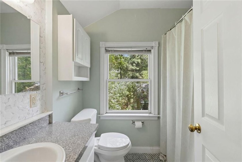 Set on nearly an acre in North Kingstown, this 3-bedroom, 1-bath - photo 23