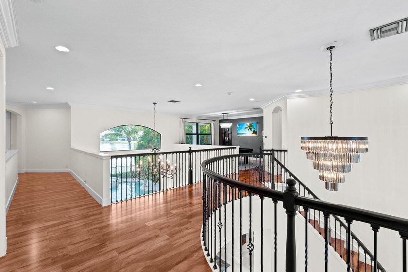 Beyond double entry doors, a remodeled iron staircase frames - photo 24