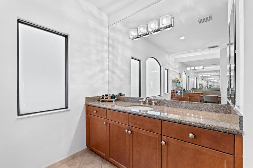 Beyond double entry doors, a remodeled iron staircase frames - photo 37