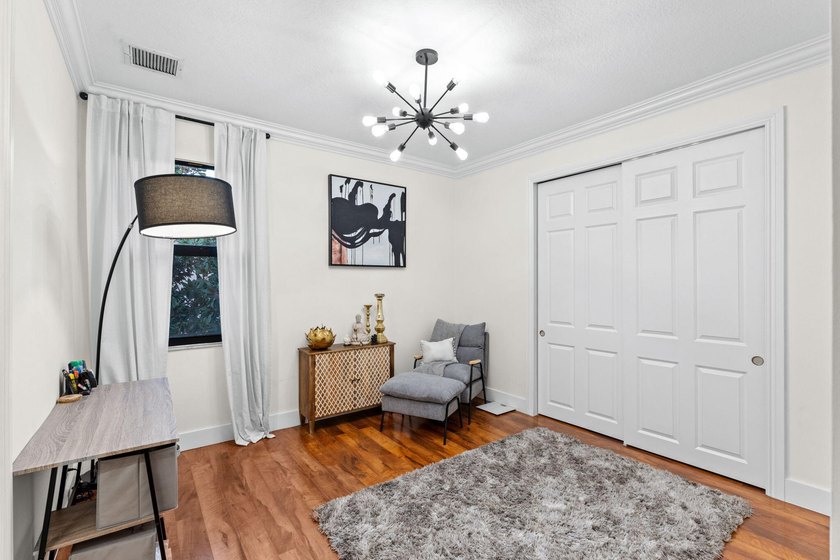 Beyond double entry doors, a remodeled iron staircase frames - photo 41