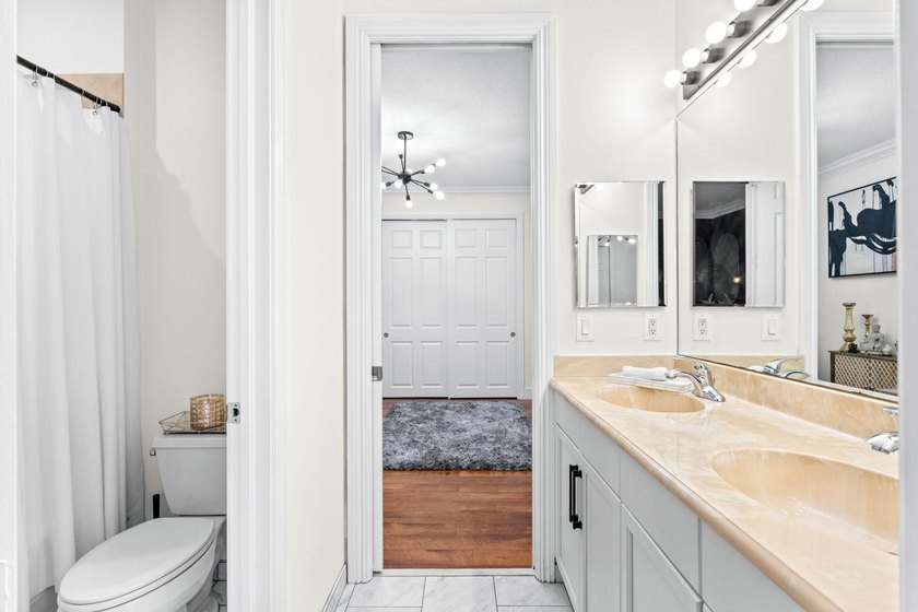 Beyond double entry doors, a remodeled iron staircase frames - photo 43