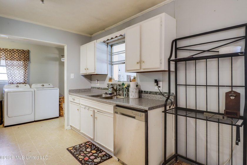 This charming Biloxi property is the perfect blend of comfort - photo 8