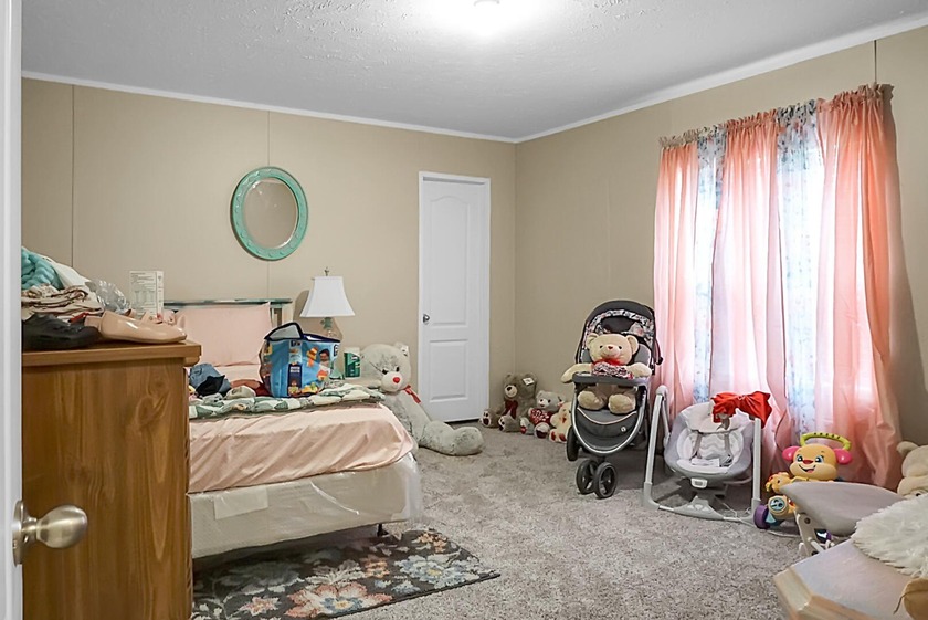 Welcome to this beautiful 4-bedroom, 2-bath home tucked away in - photo 32