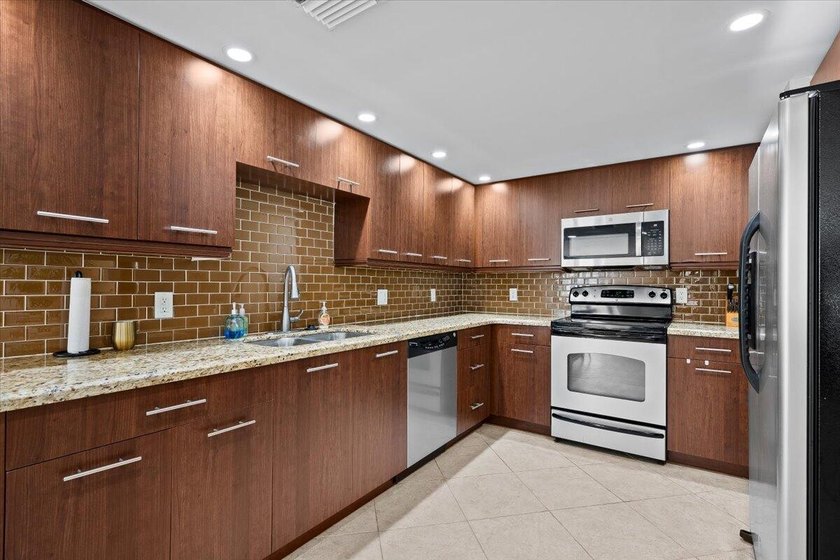 Enjoy beachfront living at its finest in this fully furnished - photo 9