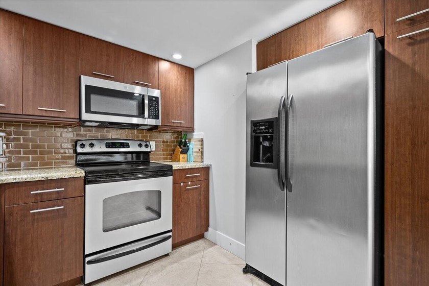 Enjoy beachfront living at its finest in this fully furnished - photo 10