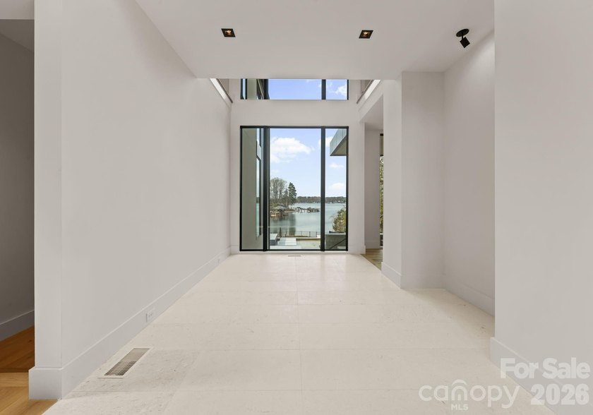 Private by design. Defined by the lake. Behind private gates and - photo 4