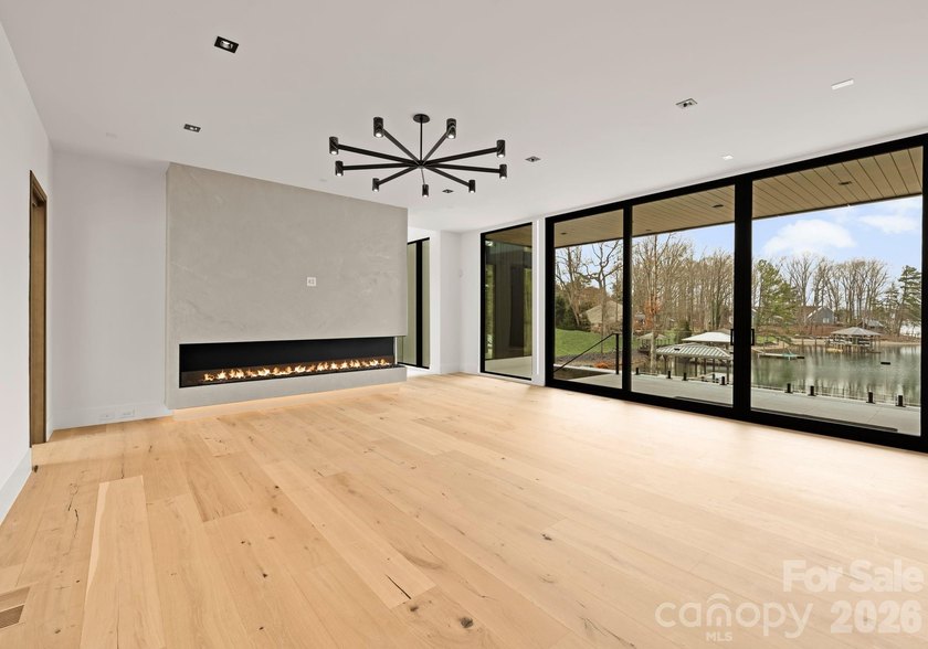 Private by design. Defined by the lake. Behind private gates and - photo 9