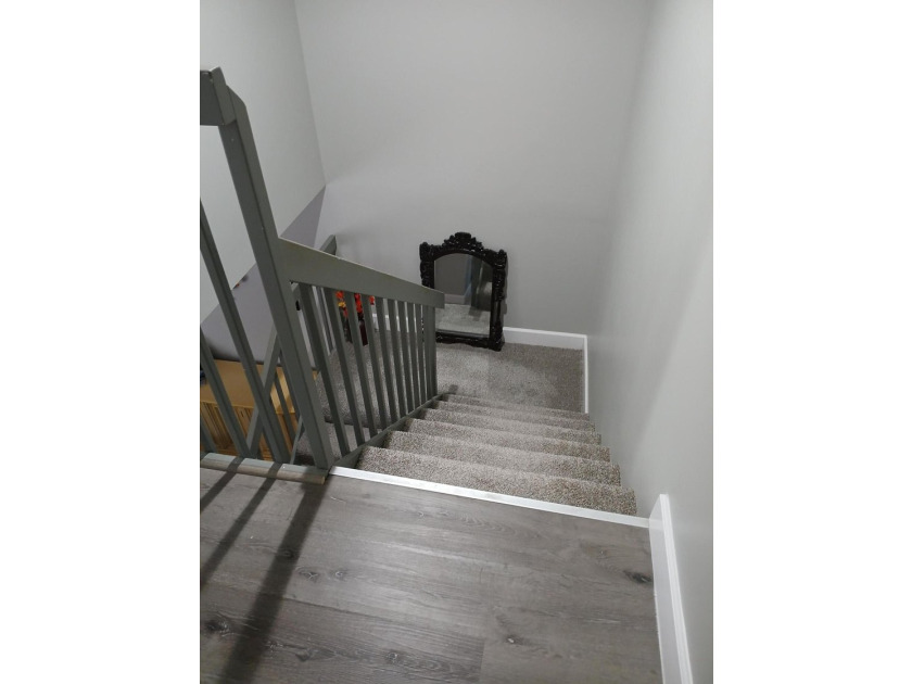 Centrally located large townhome with tile on 1st floor, wood on - photo 15