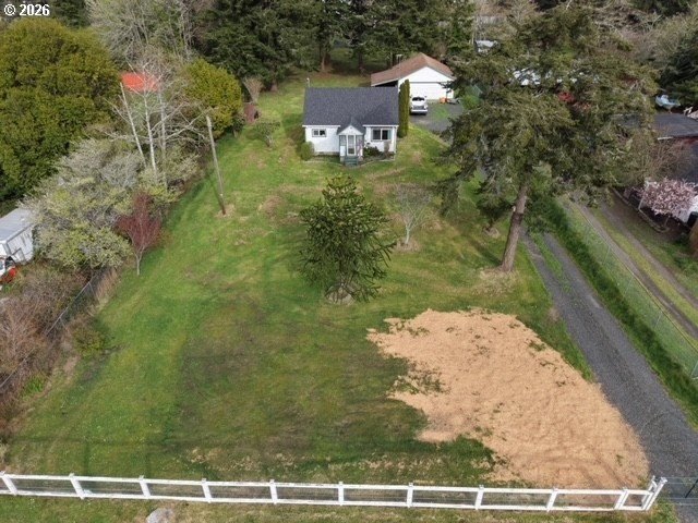 Nearly one-acre level setting with a charming white fence entry - photo 8