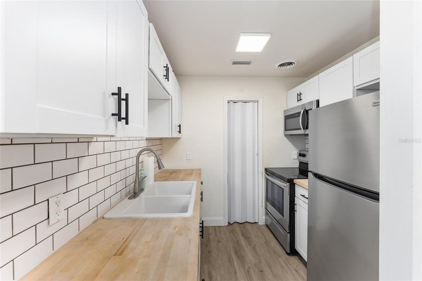 This beautifully updated concrete block home has been - photo 10