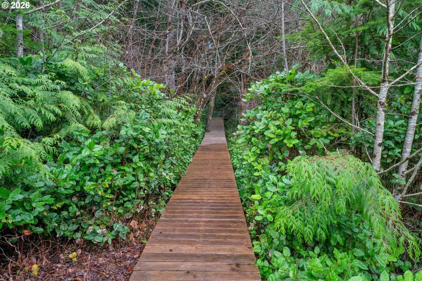 First time on the market, this custom-built retreat offers your - photo 42