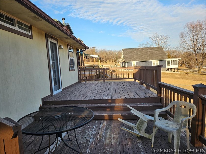 This lakefront homes has many pluses: one level living, attached - photo 11
