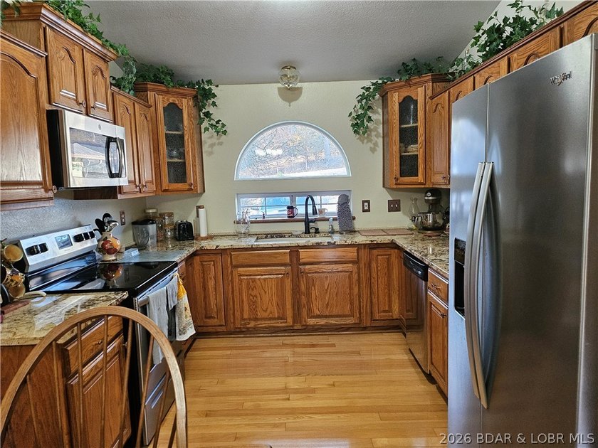 This lakefront homes has many pluses: one level living, attached - photo 19