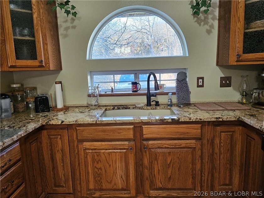 This lakefront homes has many pluses: one level living, attached - photo 20