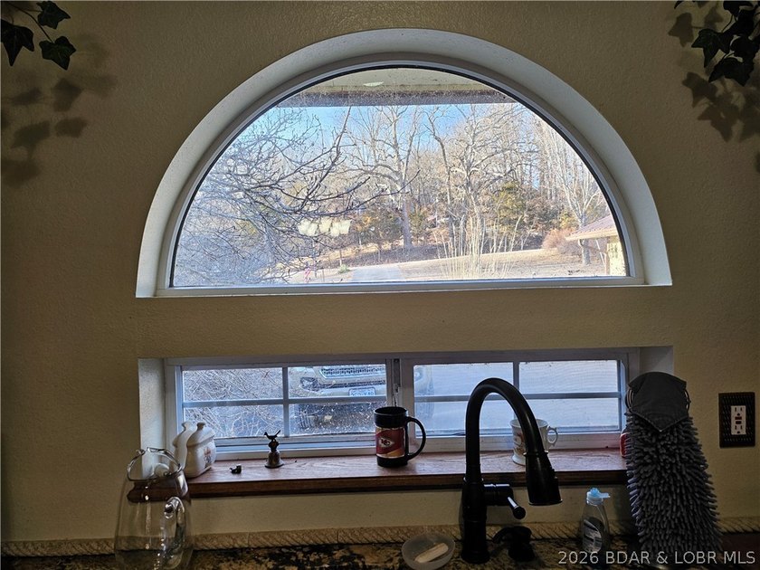 This lakefront homes has many pluses: one level living, attached - photo 21