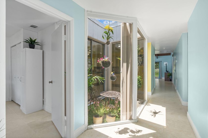 Welcome home to this spacious 3-bed, 2-bath corner Villa in a - photo 5