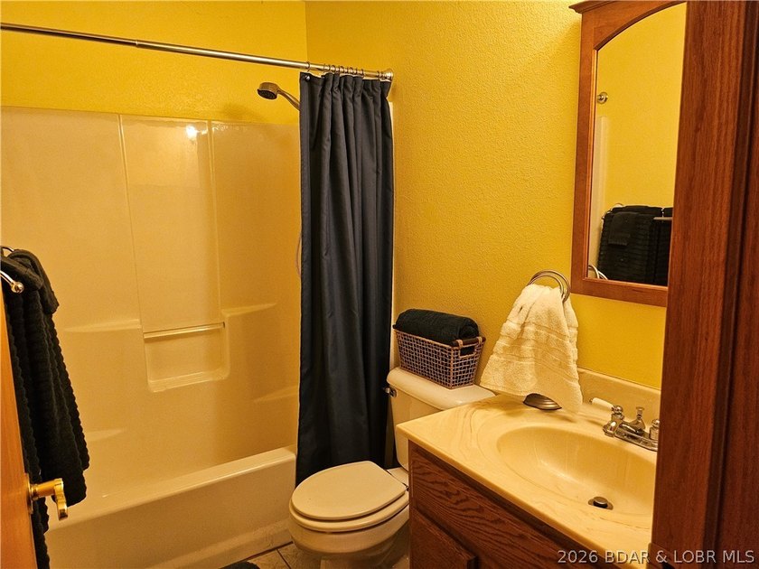 This lakefront homes has many pluses: one level living, attached - photo 39