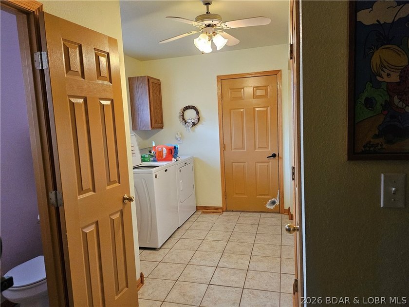 This lakefront homes has many pluses: one level living, attached - photo 46
