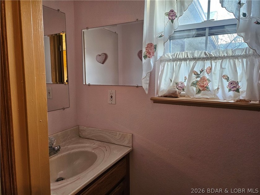 This lakefront homes has many pluses: one level living, attached - photo 48