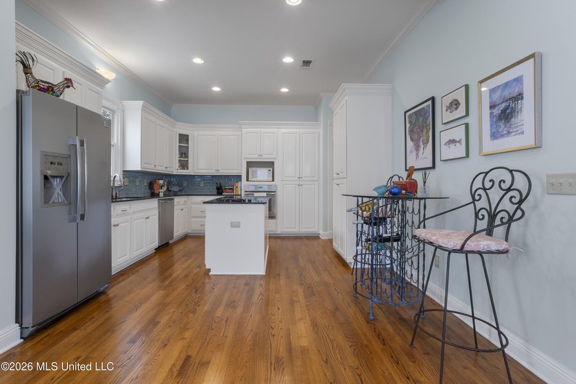This two-story Coastal Southern Style home is nestled in a - photo 9