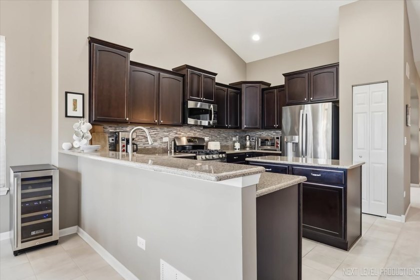 Enjoy carefree, low-maintenance living in this meticulously - photo 11