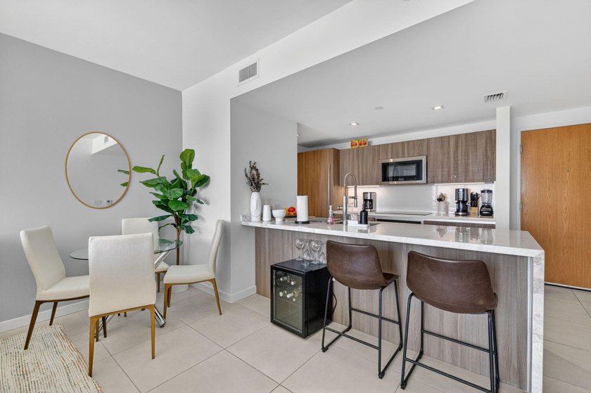 Turnkey coastal living awaits in this beautifully furnished - photo 3