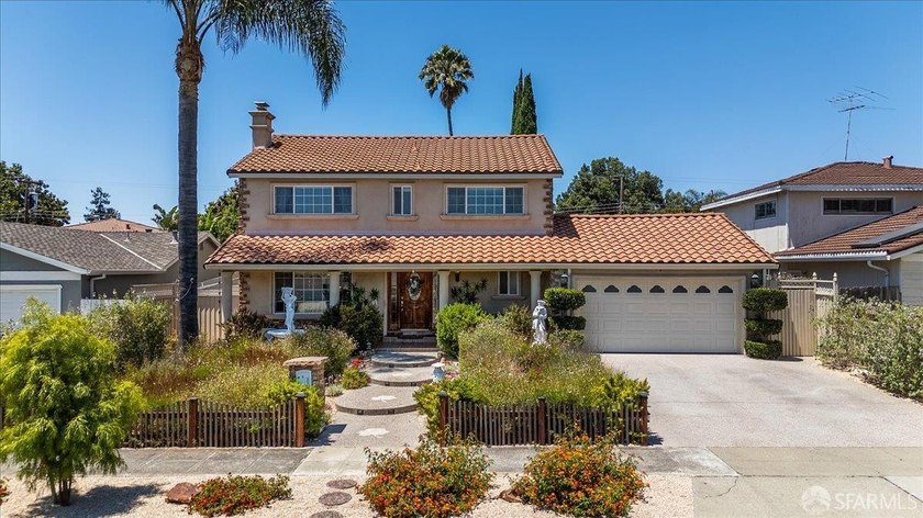 This spacious 4-bedroom, 3-bathroom Spanish Colonial Revival - photo 2