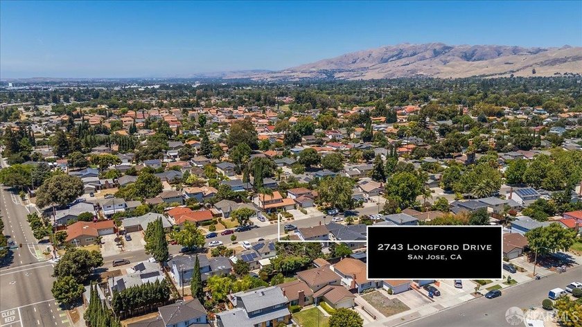 This spacious 4-bedroom, 3-bathroom Spanish Colonial Revival - photo 4