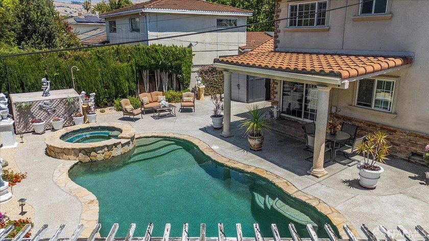 This spacious 4-bedroom, 3-bathroom Spanish Colonial Revival - photo 8