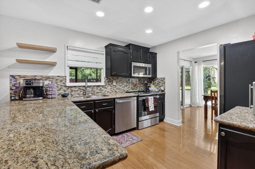 This charming home boasts hardwood floors throughout, granite - photo 11