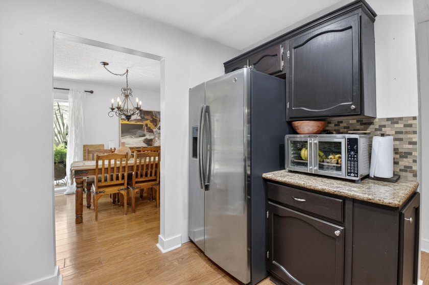 This charming home boasts hardwood floors throughout, granite - photo 13