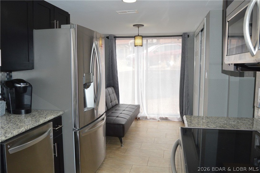 This ground-floor, 1-story, end unit offers plenty of room for - photo 11