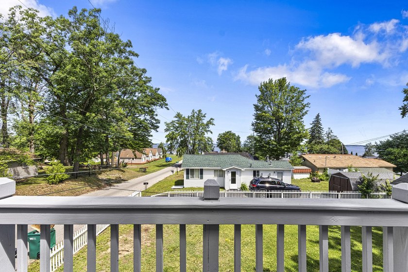 Wake up to beautiful views of Houghton Lake from the spacious - photo 5