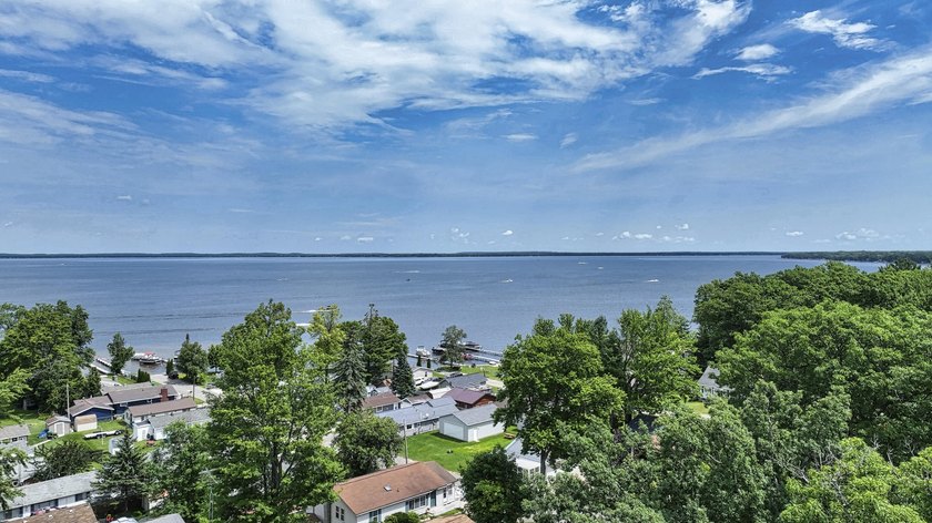 Wake up to beautiful views of Houghton Lake from the spacious - photo 6