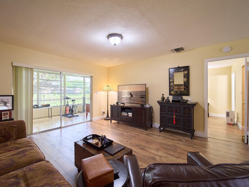 Welcome to this charming 2-bedroom, 2-bathroom villa nestled in - photo 5