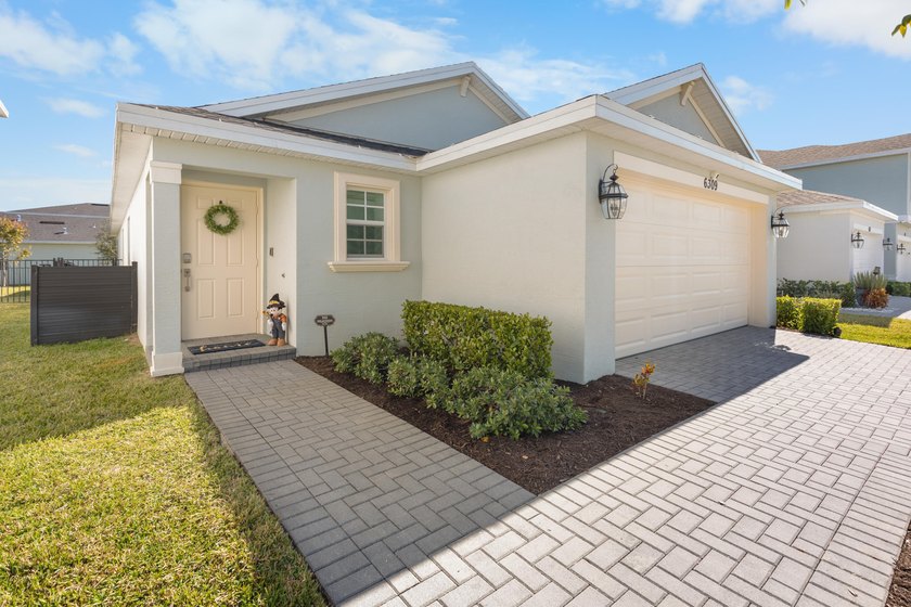 This new single-story home features a smart layout designed for - photo 2