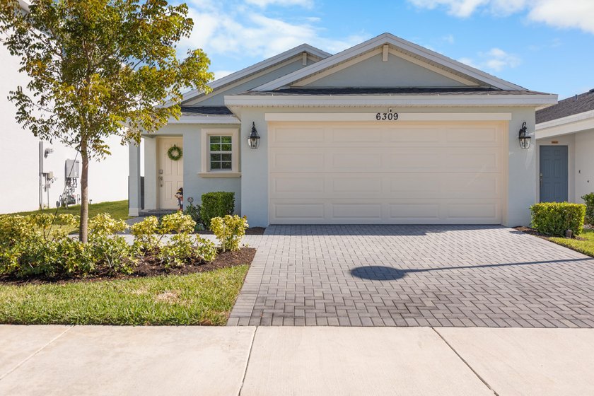 This new single-story home features a smart layout designed for - photo 7