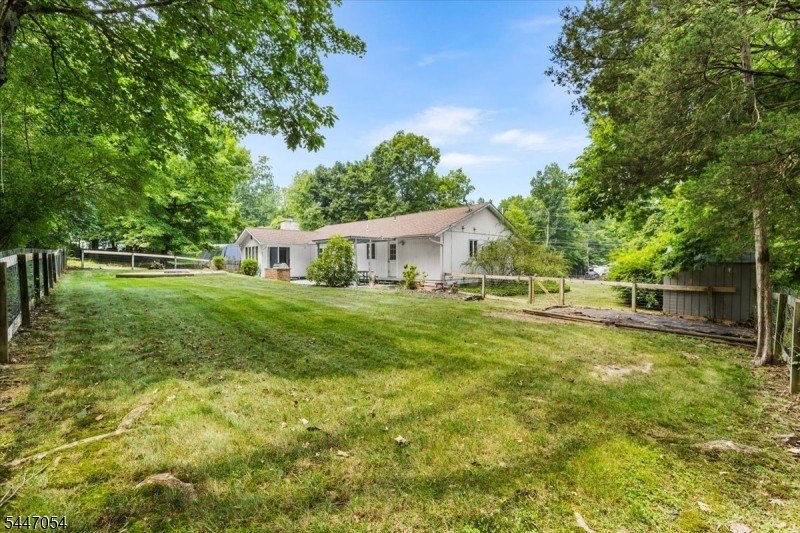 Easy one floor living in this expanded Ranch situated on nearly - photo 2