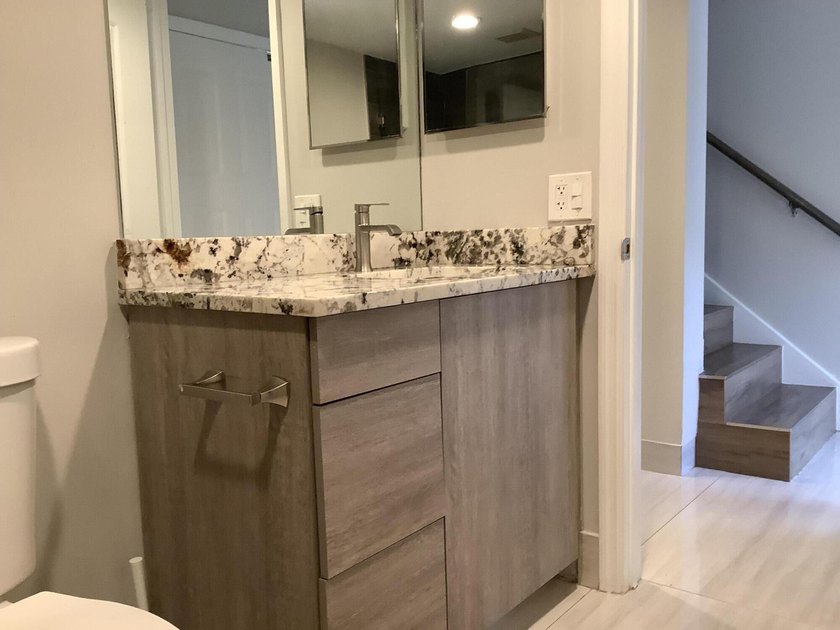 This beautifully renovated 2-bedroom, 2-bathroom townhouse is - photo 16