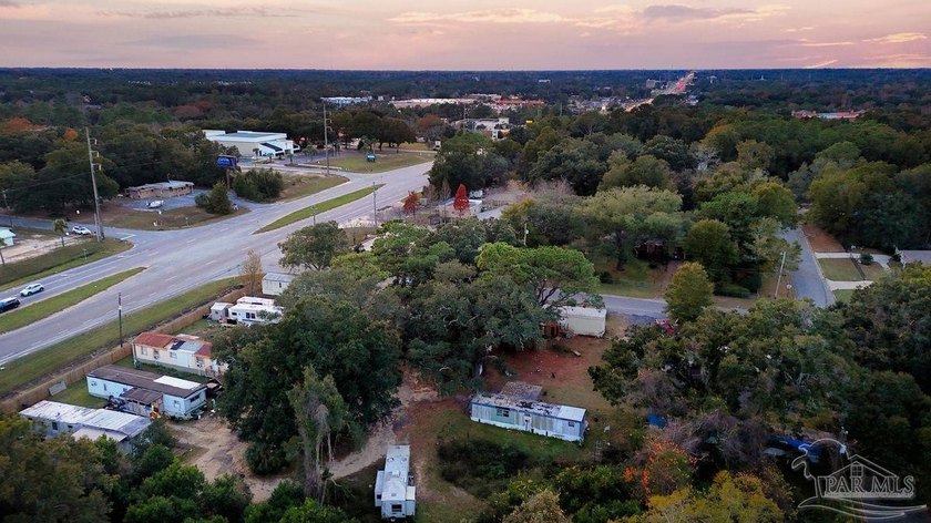 1.3 acre parcel with over 200 feet of road frontage on 9-Mile Rd - photo 3